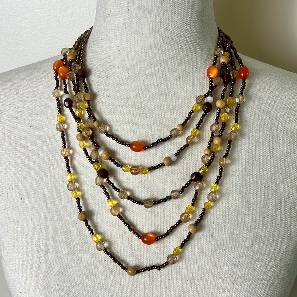 Multi-strand orange, yellow, brown beaded necklace